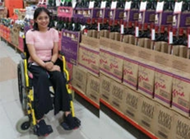 Joan Canporedondo sitting on a wheelchair